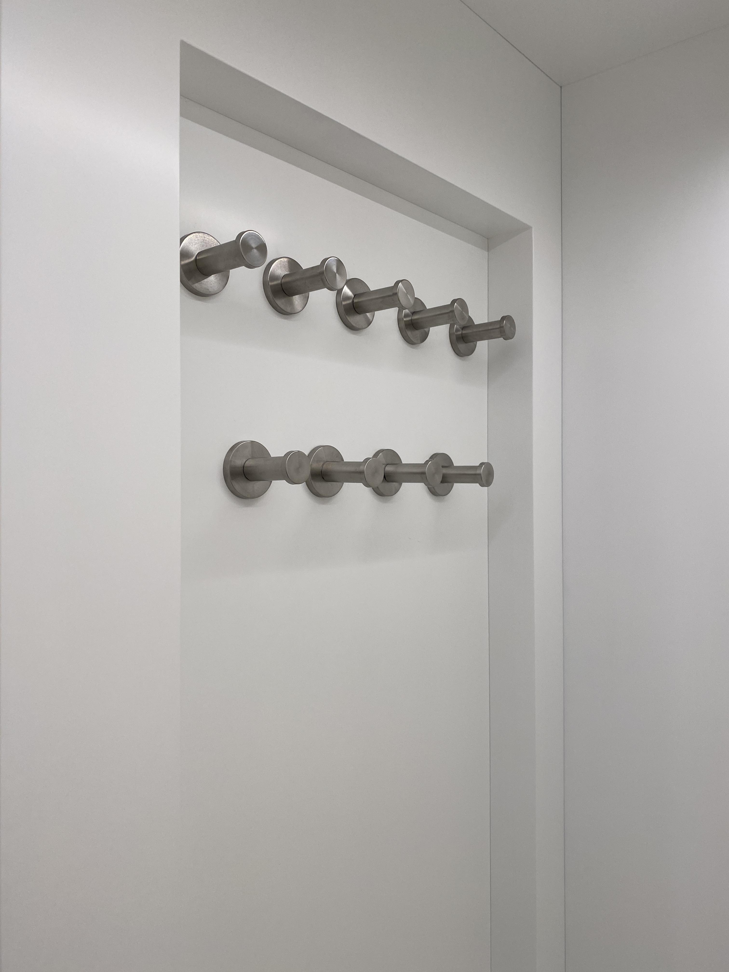 Sleek, modern closet with hidden storage | Woodworking Network
