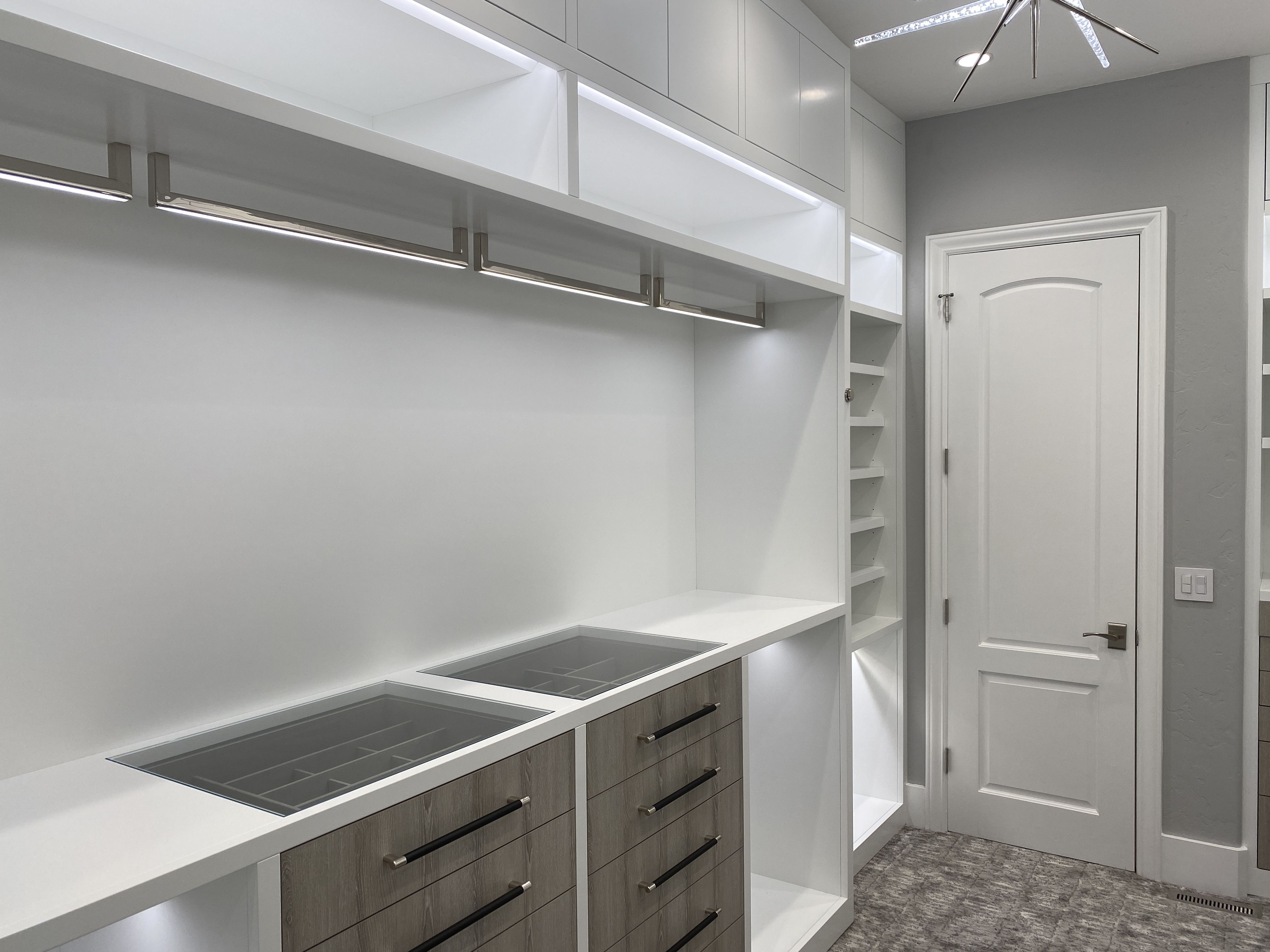 Sleek, modern closet with hidden storage | Woodworking Network