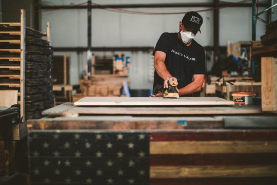 Sanding a flag of valor