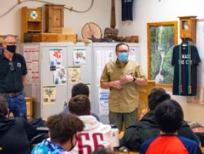 Saúl Martín of AWC (right) talks with students at Desert Oasis High School on Friday, October 22 with Instructor Tim Wenzel (left). 