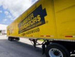 Lumber Liquidators buys China firm, lowers forecast
