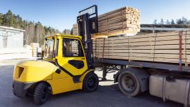 Forklift loading lumber