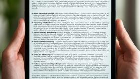 A tablet graphic containing CCI Media's AI Policy.