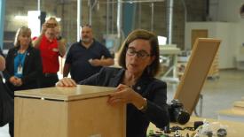 1709FDMCcabinotch4-Governor-Kate-Brown-assembling-cabinotch-box.jpg