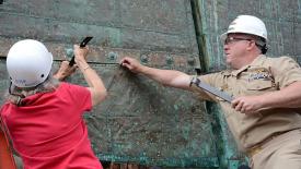 Removing copper sheaths from oak sides of USS Constitution