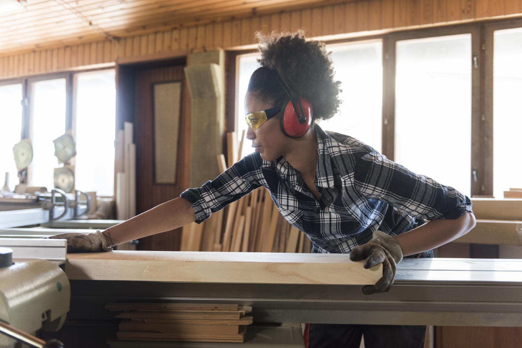 Female woodworker table saw